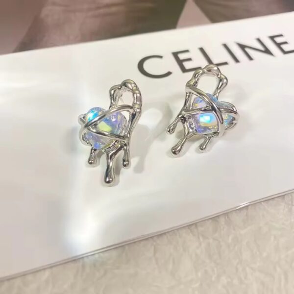 Moonstone inside a fancy silver coated heart