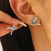 Antitarnish Silver coated Blue Hummingbird stud earrings with Aqua coloured Zircon Stone.