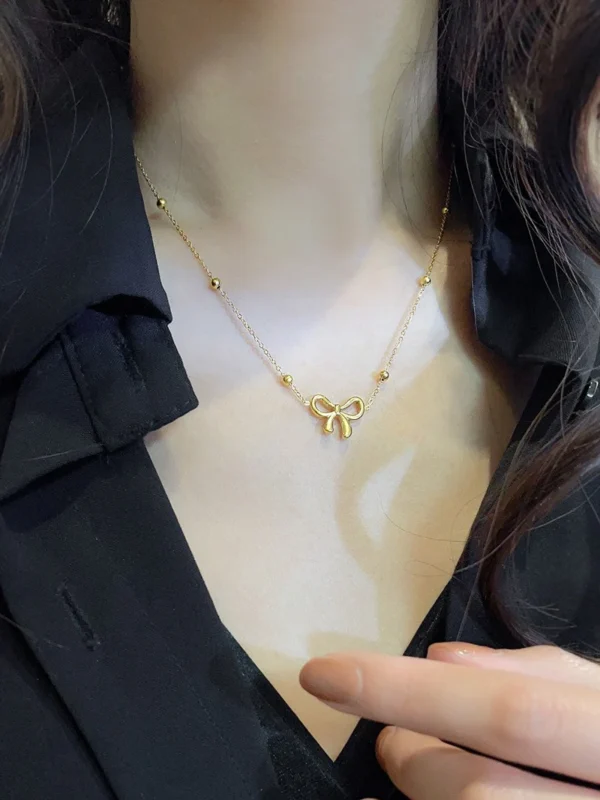 18k gold plated on 316L stainless steel bow necklace - Image 7